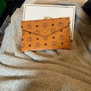 MCM Visetos Envelope Clutch In Cognac